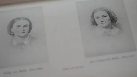 BBC Two black and white drawings of Emily and Anne-Louise Baily on a page in a book.