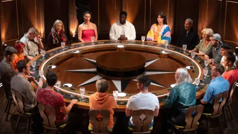 The Traitors contestants around the round table