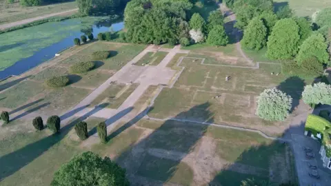 National Trust Aerial photograph showing the site of Clumber House, where dry conditions have meant the walls of the building have shown up as lines of dead grass
