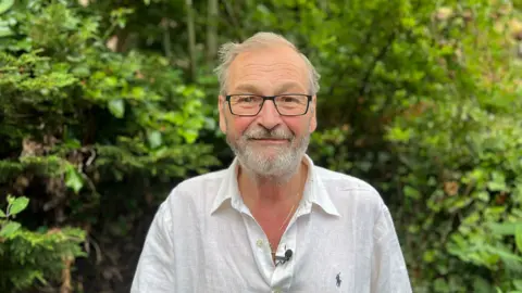 Christopher York, from Ashgate in Chesterfield standing in his garden