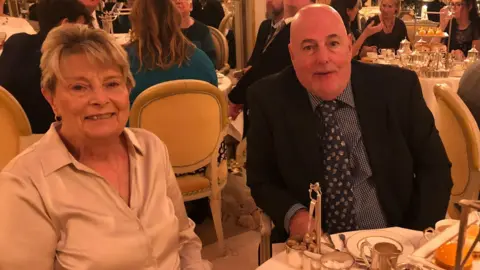 Supplied Pat Bailey on the left and her husband David Bailey on the right sat inside the Ritz Hotel in London for their 50th wedding anniversary in 2019