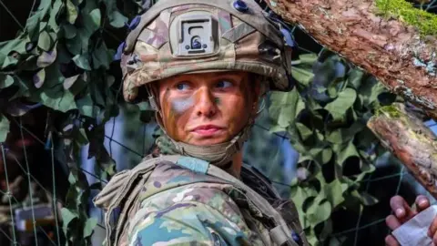 A British soldier of a gun battery attends the Allied Spirit 25 exercise in Hohenfels, Germany, 12 March 2025