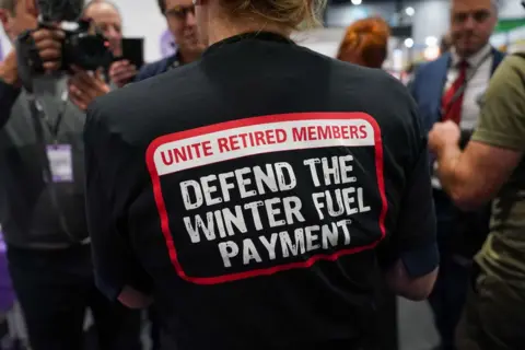 Getty Images Sharon Graham, General Secretary of Unite the Union leads a small protest in the exhibition hall against the cuts to winter fuel payments during the Labour Party Conference 2024.