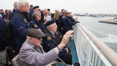 PA Media D-Day veterans gather on the deck of Mont St Michel
