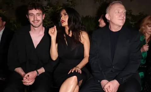 Getty Images Paul Mescal, Salma Hayek and François-Henri Pinault attend the Gucci Cruise 2025 Fashion Show at Tate Modern on May 13, 2024 in London, England