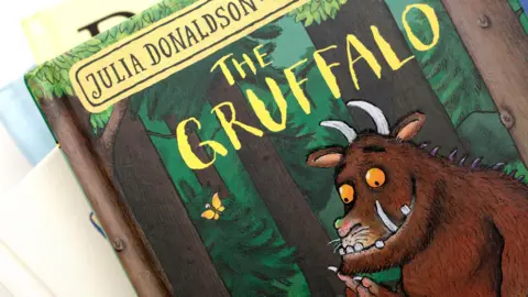 File photo shows a stack of books with the top cover in frame, of The Gruffalo with the name 'Julia Donaldson' on top and the title saying 'The Gruffalo', taken in 2021