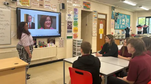 BBC News Students at Birchgrove Comprhehensive looking at pictures of Keir Starmer and Eluned Morgan