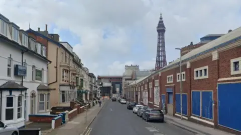 Google streetview of roads going to the shopping centre between hotels and a redbrick venue. Blackpool Tower can be seen rising in the backdrop
