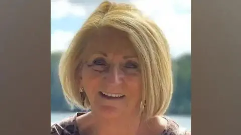 Family handout Kathleen McGinness is smiling at the camera. She has blonde bobbed hair.