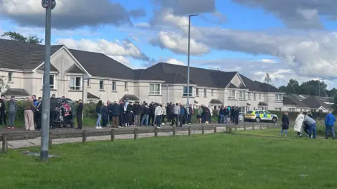 People gather at houses in Coleraine 