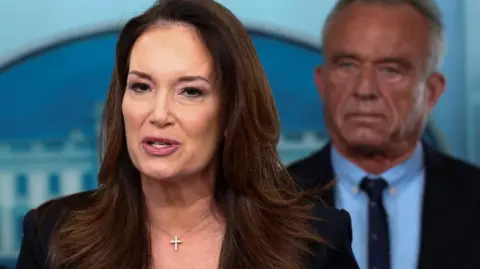 US Agriculture Secretary Brooke Rollins speaks during a briefing at the White House, as U.S. Secretary of Health and Human Services Robert F. Kennedy Jr. stands behind her
