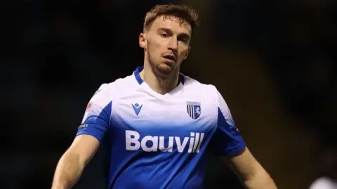 Conor Masterson in action for Gillingham 