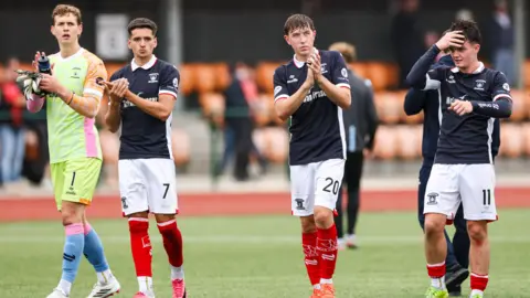 Falkirk players celebrate Saturday's Premier Sports Cup win over 