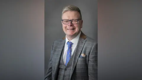 Portrait of Cheshire East Councillor and deputy mayor Rob Moreton