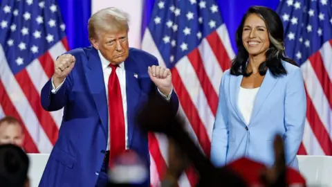 Trump dancing on stage with Gabbard