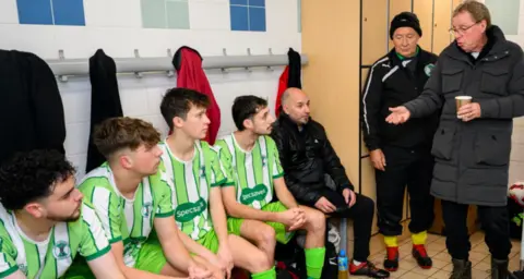 Tunley Athletic Harry Redknapp gives a team talk to the Tunley Athletic players, dressed in their green and white kit