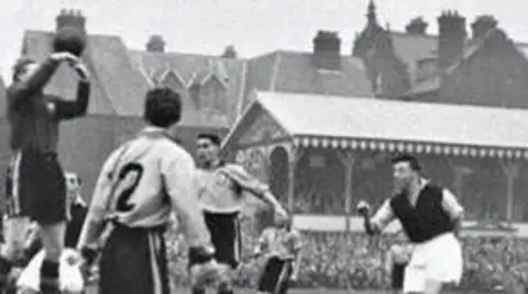 Great Yarmouth Town FC Goalkeeper jumping for ball in an archive photo of a football match at Great Yarmouth