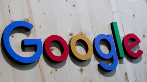 Google's primary-colored logo on a large wooden sign.