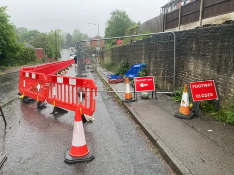 Roadworks at collapsed wall