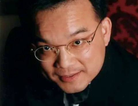 PA Media Close up image of Kenneth Law's face. He is looking at the camera and is wearing glasses.