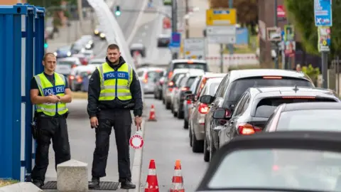 Maja Hitij/Getty Images German federal police watch over cars arriving at the German-Polish border on September 10, 2024 in Frankfurt an der Oder, German