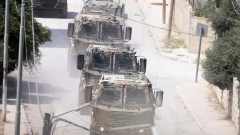 EPA Israeli troops move inside the Jenin refugee camp on the fourth day of the operation in Jenin, August 31, 2024