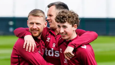 Stephen Kingsley, Lawrence Shankland and Kier McMeekin during a Heart of Midlothian training session at the Oriam, on April 22, 2026, in Edinburgh, Scotland. 