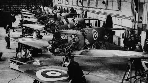 Black and white image of Spitfires being manufactured en masse for the Royal Air Force, Southampton.