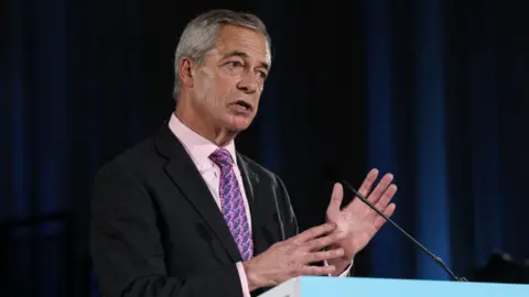 AFP via Getty Images Reform UK party leader Nigel Farage speaks during a party press conference in central London
