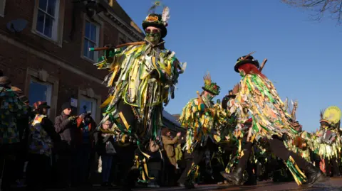 PA Media Morris and molly dancers. 