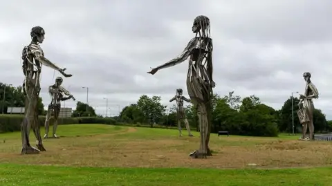 Getty Images A Millennium Project sculpture named 'Let the Dance Begin' stands near the Irish border in Strabane, Northern Ireland