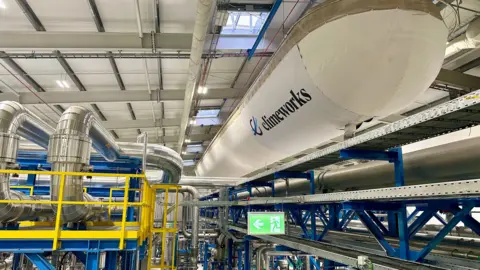 Pipework and the large flask that holds the CO2 inside the carbon capture facility