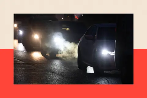 Getty Images A queue of cars illuminated by their headlights in Brentwood, Essex