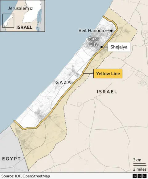 A map showing the yellow line running around a border of Gaza, with Beit Hanoun closest to the northern border, and Shejaiya near the yellow line on the north-eastern border.