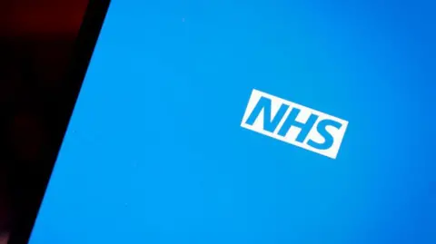 Getty Images The National Health Service (NHS) application is seen on a mobile device in this photo
