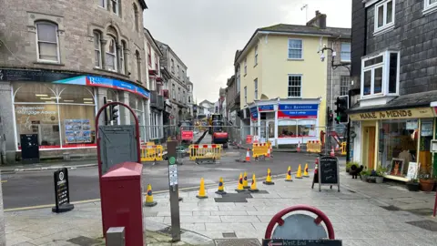 Cones blocking off a town centre street to allow gas works