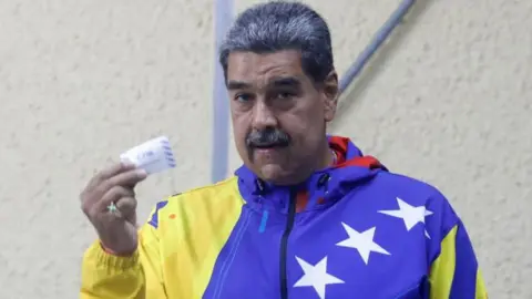 Reuters Venezuelan President Nicolas Maduro votes during presidential election in Caracas, Venezuela July 28, 2024.