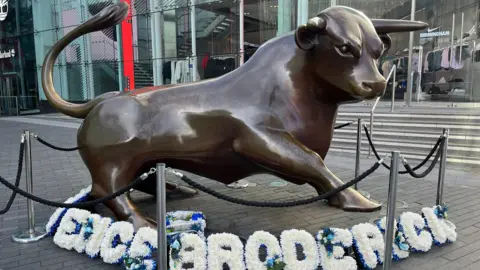 John Bray Tributes appeared at Birmingham's bull statue on Friday