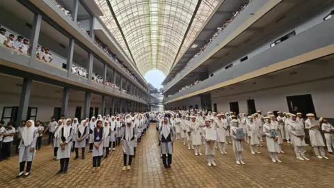 Sasi Kayyoor A group of students in uniform in Kerala state during a Zumba session. Several religious groups in Kerala have opposed the government's decision to introduce Zumba classes in schools. 
