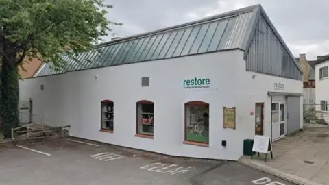 Google maps Outside Restore's The Orchard service in Banbury. A view from the car park. It is cloudy day.