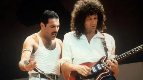 Getty Images Queen perform at the Live Aid concert in 1985 at London's Wembley Stadium