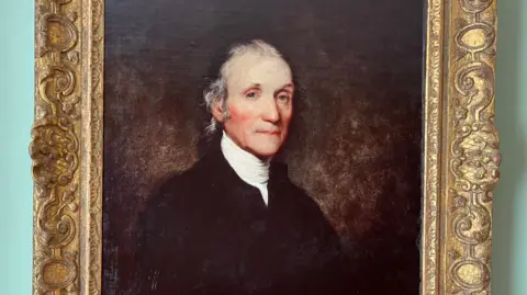 A painting of Joseph Priestley in a large gold frame