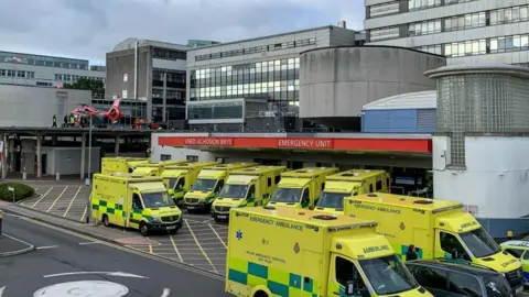 Getty Images The Accident and Emergency Unit at the University Hospital Wales showing ambulances parked outside the Emergency unit together with one of the Welsh Air Ambulance.