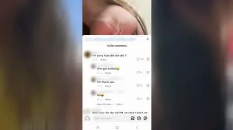 TikTok A screengrab of a TikTok video with the comments up. They say:
I'm sorry how did she die?
She got bullied
Oh thank you
Np
You can partially see a young blonde girl behind the comments.