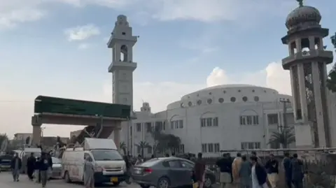 Mid shot view of the madrasa and of the Darul Uloom Haqqania mosque 