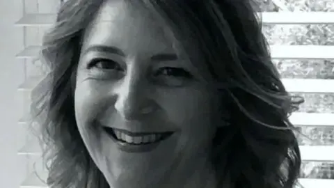 Close up black and white image of Samantha Mickleburgh 