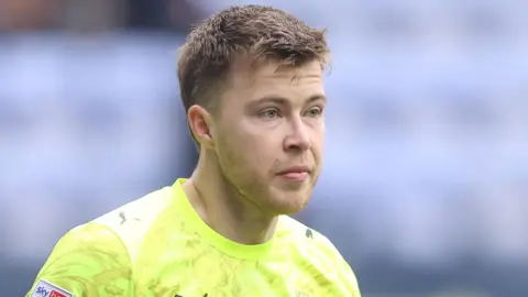 Bailey Peacock-Farrell in action for Blackpool this season