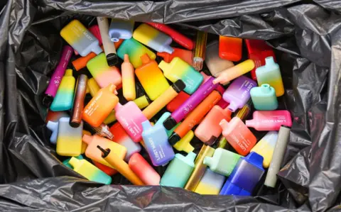 Getty Images Discarded disposable vapes in a bin