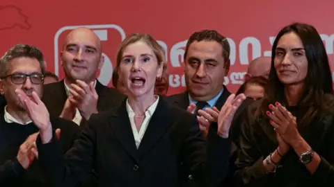 VANO SHLAMOV/AFP Tina Bokuchava, chairwoman of the opposition United National Movement, delivers a speech during a meeting at the party's headquarters after the announcement of exit polls during parliamentary elections in Tbilisi on October 26, 2024.