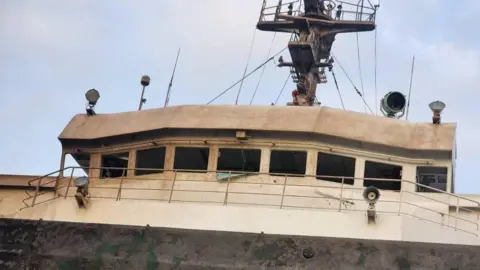 The cargo ship Paresa, damaged by a Russian missile strike, amid Russia's attack on Ukraine, in the seaport of Pivdennyi, in Odesa region, Ukraine, in this handout released October 7, 2024